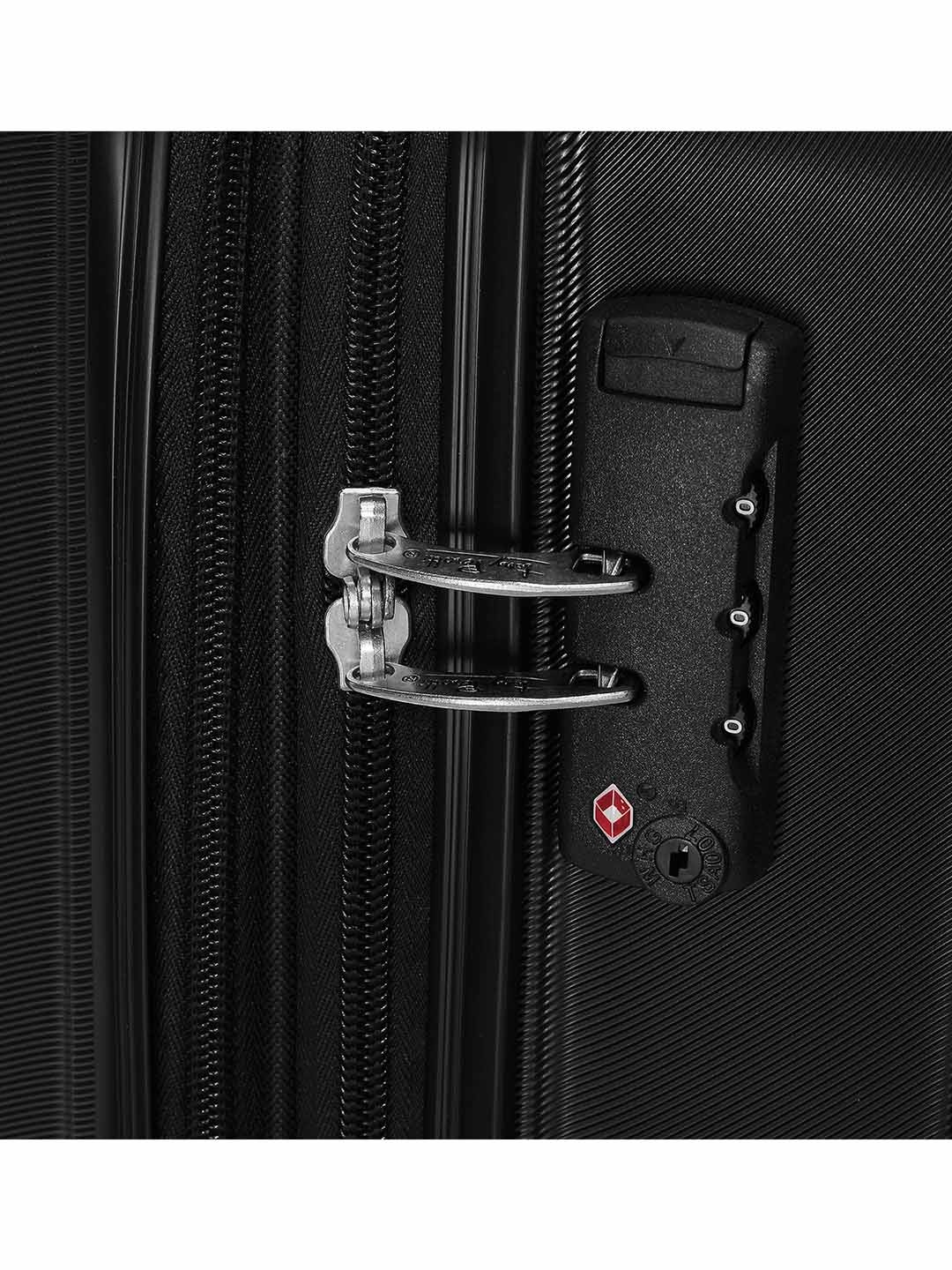 Фото Большой чемодан на колесах из рифленого ABS пластика черного цвета Чемоданы